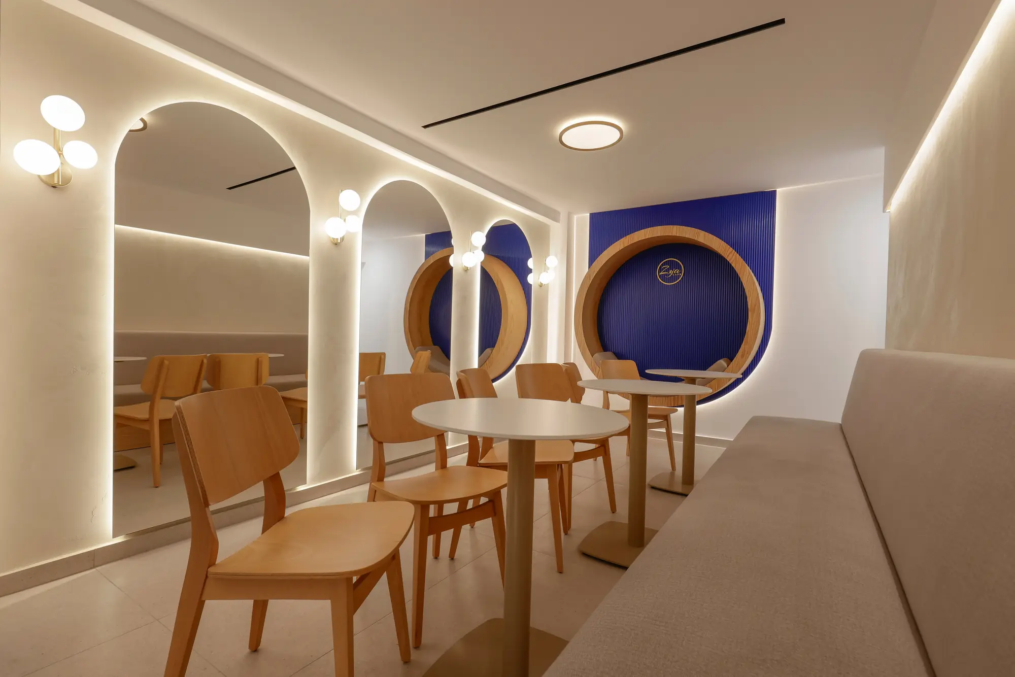 The arched, warmly lit interior of Zya Cafe in Larnaca