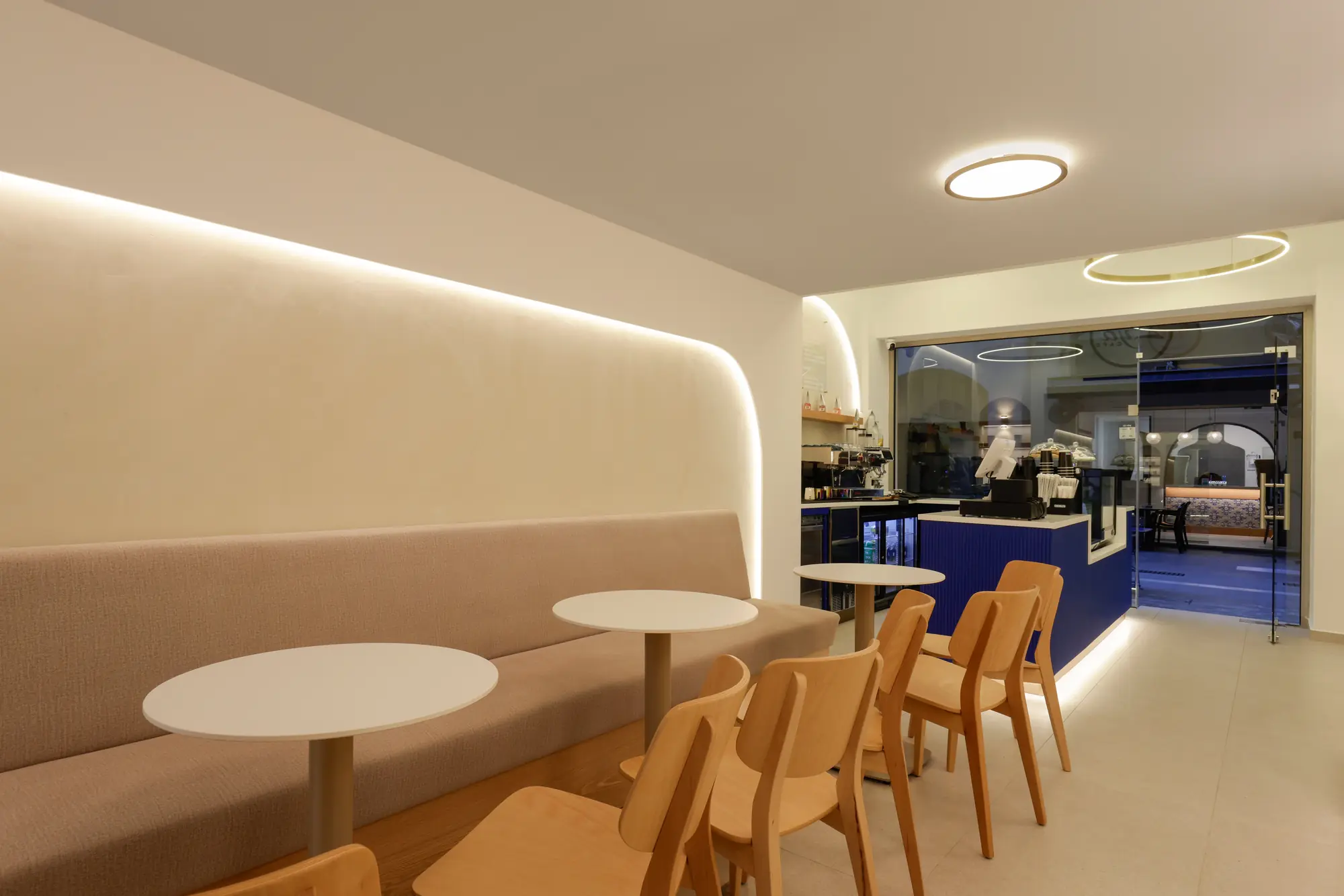 Zya Cafe interior with banquette seating and the illuminated counter